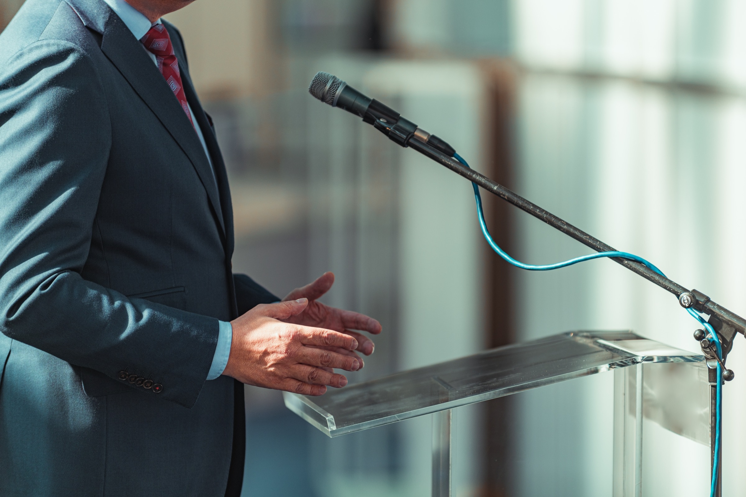 Business presentation with microphone in a formal setting