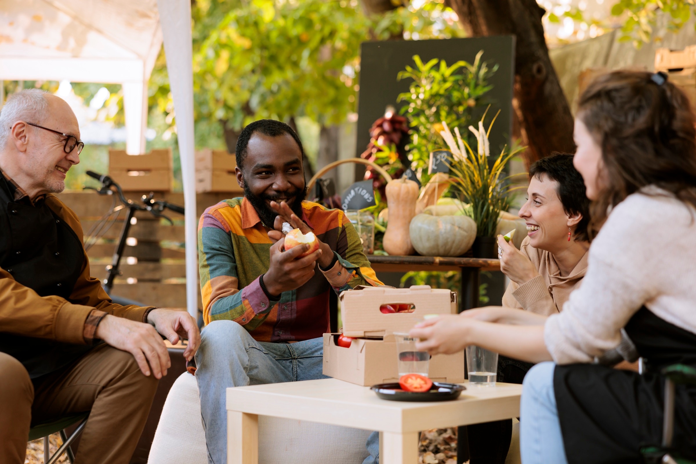 People enjoying local food at an outdoor market